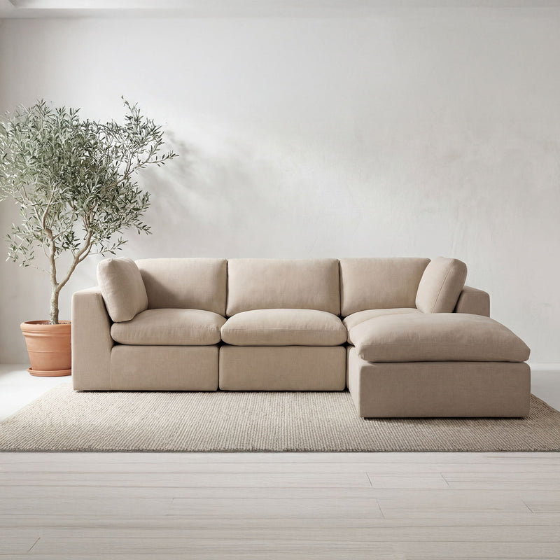 Beige fabric modular sectional with ottoman section and chaise-style side