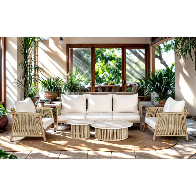 Beige patio seating set with white cushions, two armchairs, and three round side tables
