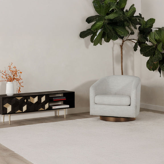 Light gray upholstered swivel accent chair with rounded back and wooden turntable base