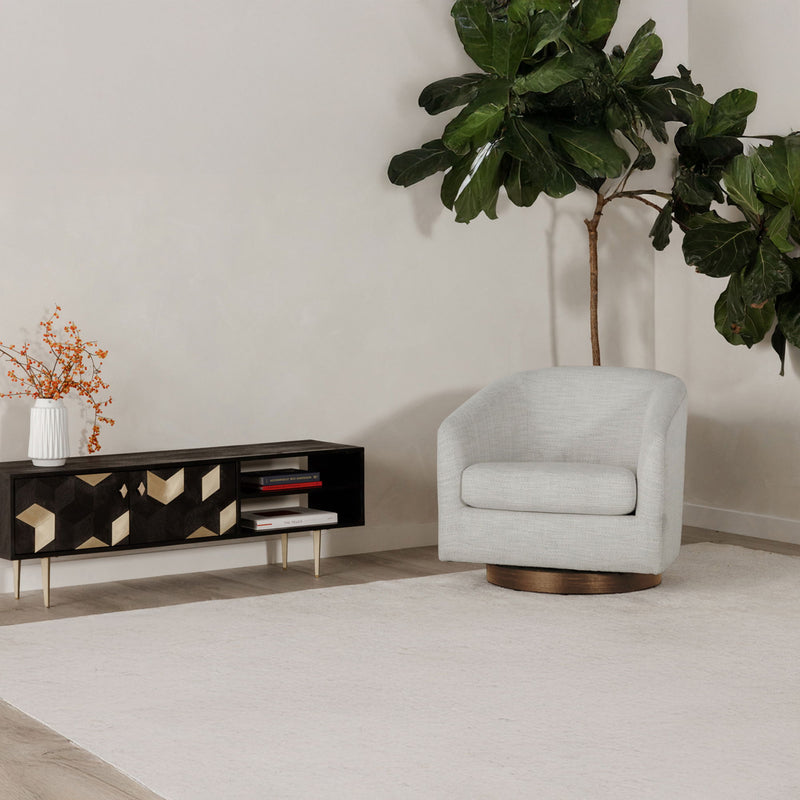 Light gray upholstered swivel accent chair with rounded back and wooden turntable base