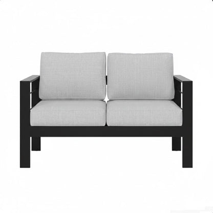 Black patio loveseat with thick light-gray cushions and two back pillows