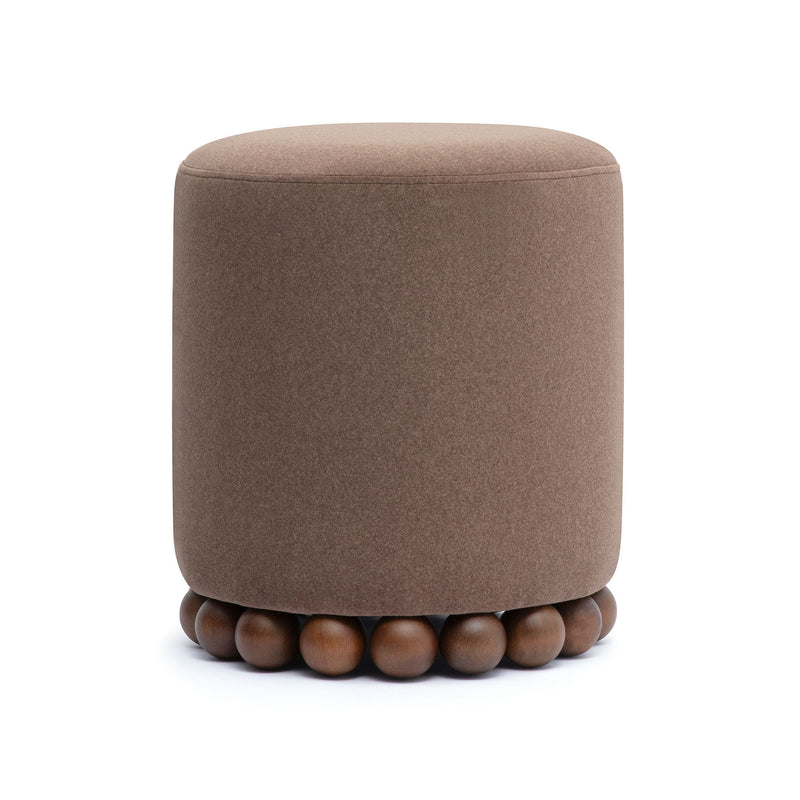 Round upholstered ottoman in dark brown with beaded wooden base