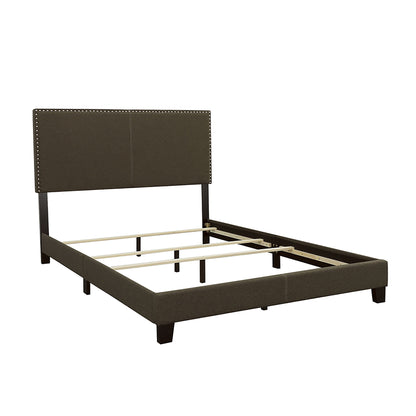 Dark gray upholstered bed with nailhead-trimmed headboard and slatted base
