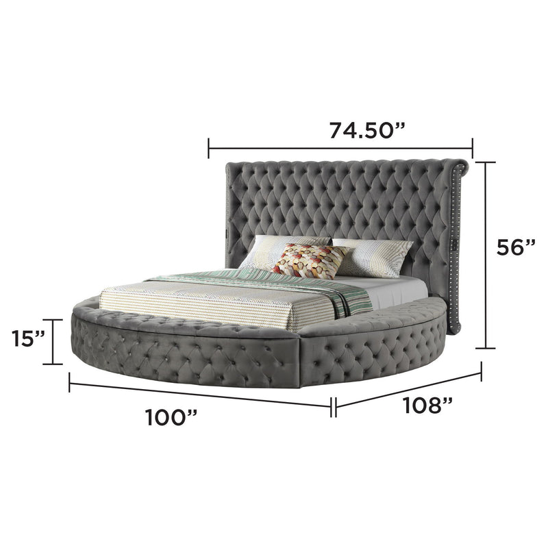 Tufted black storage bed with arched headboard, shown with measurements