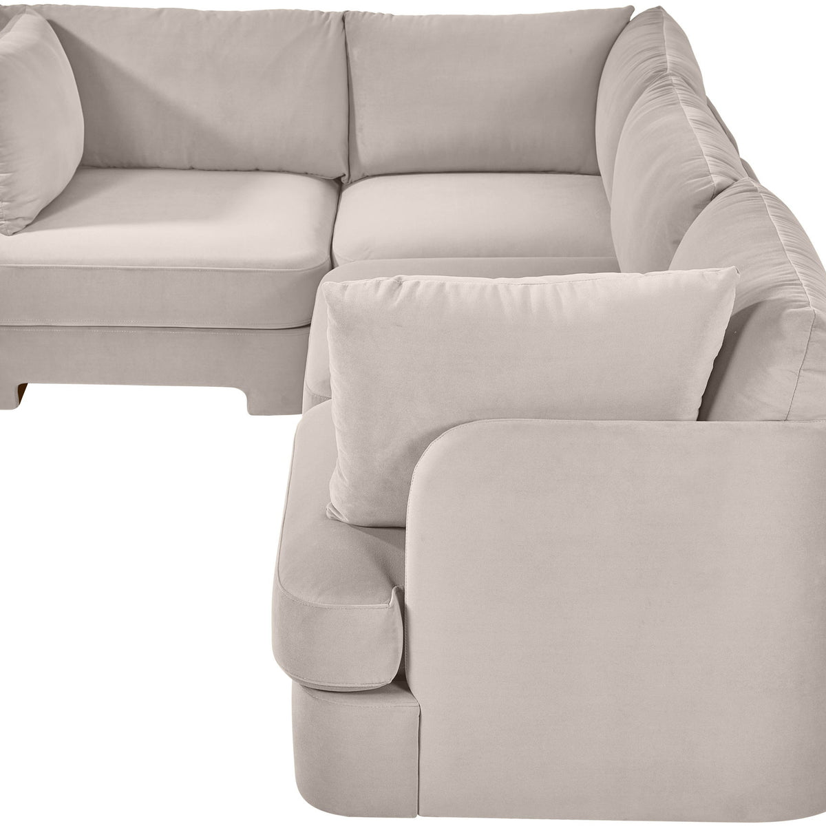 Light gray velvet performance fabric sectional with chaise corner and large accent pillows