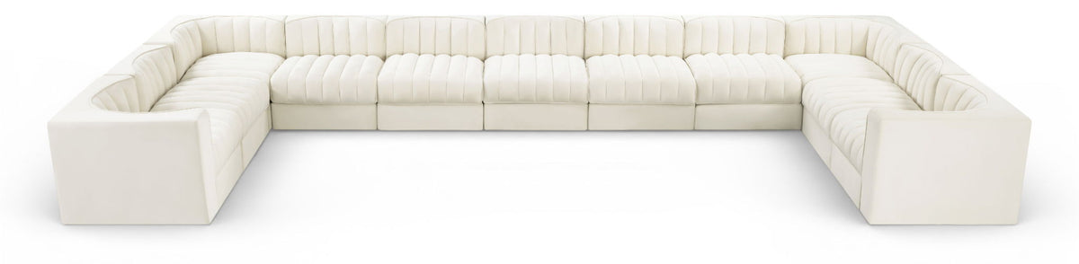 White modular sectional sofa with velvet-look upholstery and tufted cushions