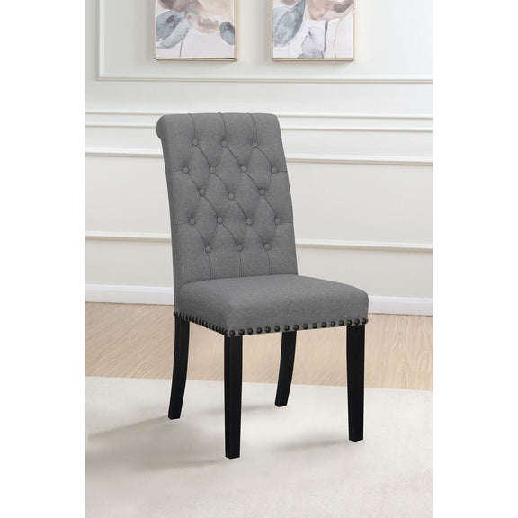 Dark gray tufted rolled backrest side chair with nailhead trim and dark wooden legs