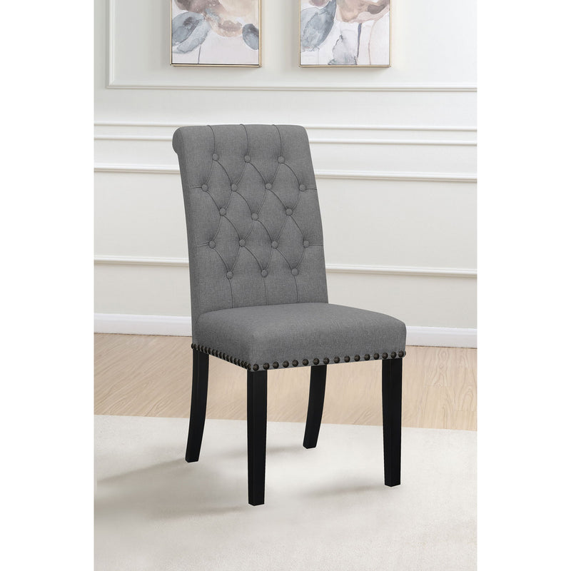 Dark gray tufted rolled backrest side chair with nailhead trim and dark wooden legs