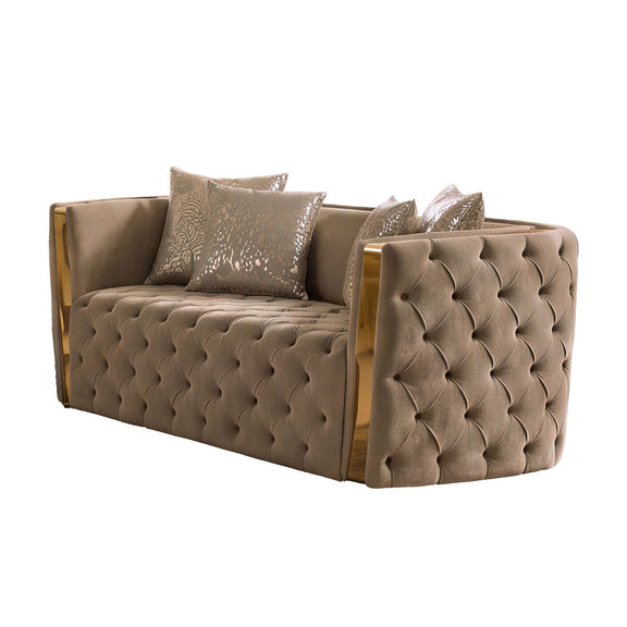 Light brown button-tufted loveseat with gold-tone side rails and patterned throw pillows