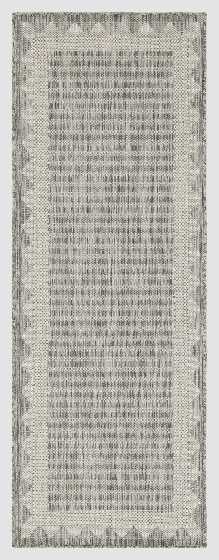 Light gray striped area rug with subtle chevron border and narrow vertical stripes