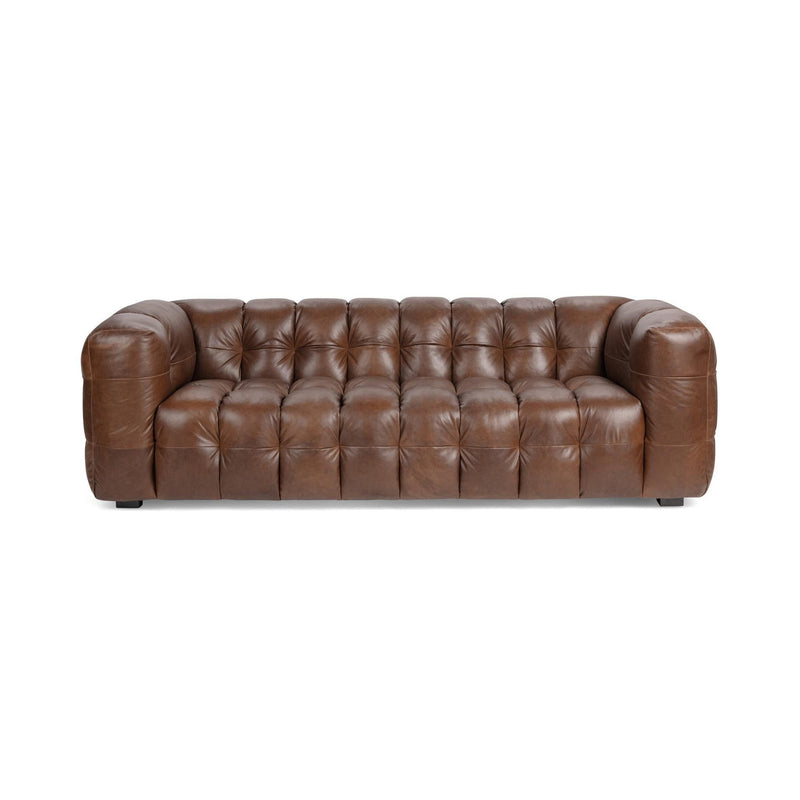 Chestnut-brown tufted leather sofa with rolled arms and square legs.