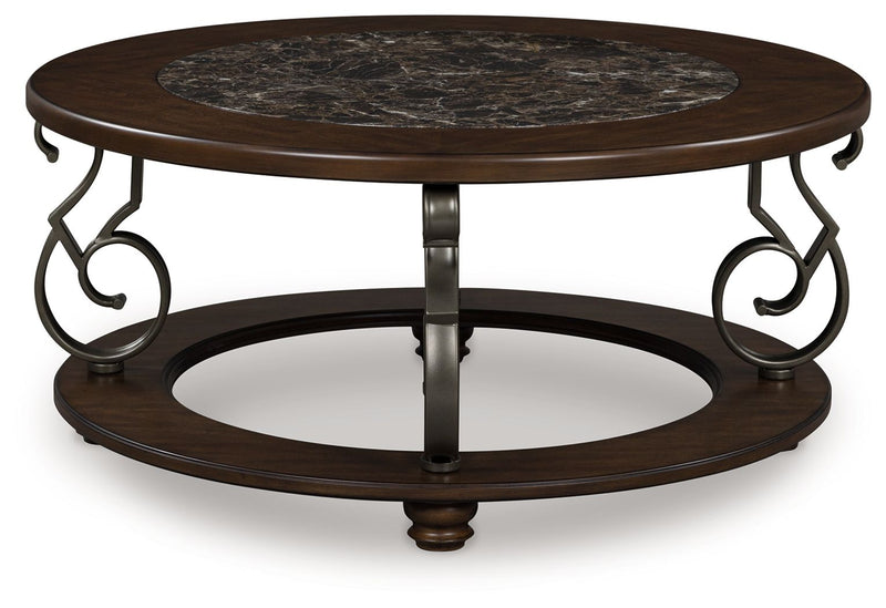 Dark brown round cocktail table with stone-look inset top and scroll metal frame