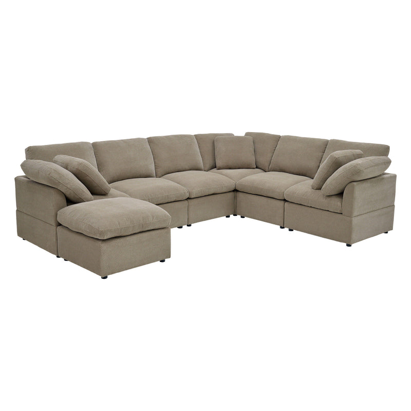 Light brown L-shaped sectional sofa with a chaise and loose cushions