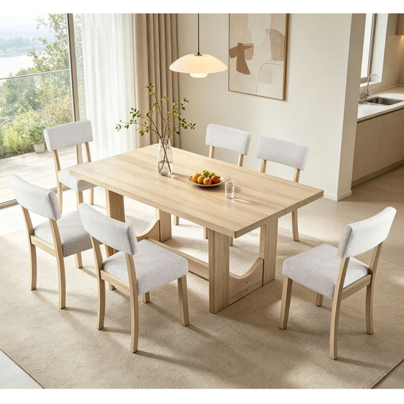 Light oak rectangular dining table with six light gray upholstered chairs and table centerpiece