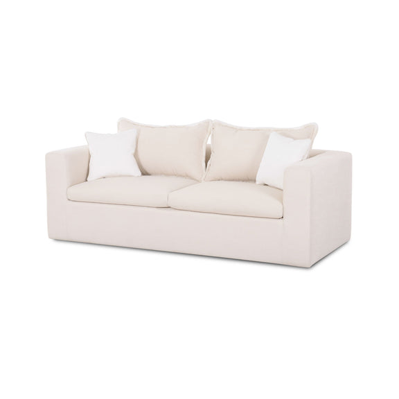 White boucle outdoor sofa with two armrests and three seat cushions plus pillows