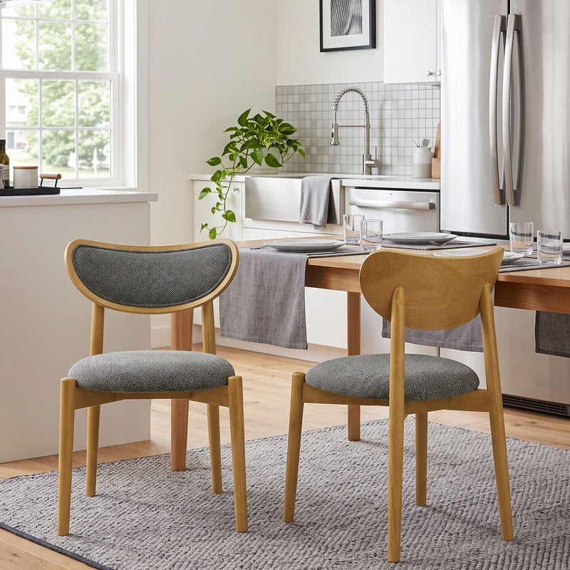 Dark gray upholstered dining chairs with wood frames, shown from front and back