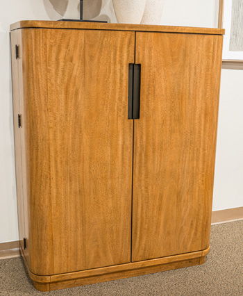 Light brown bar cabinet with two doors and vertical black bar handle