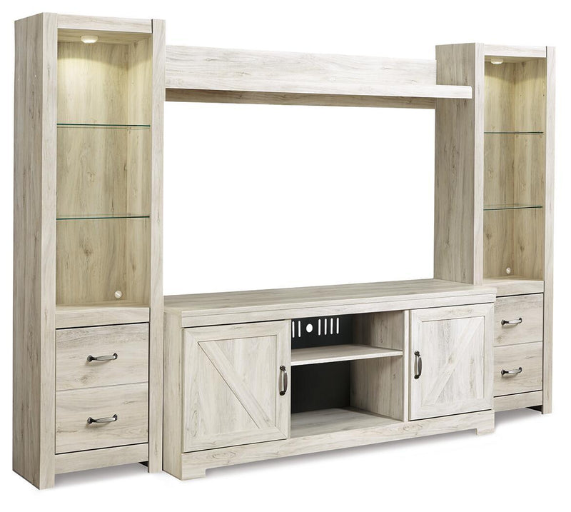 Light beige entertainment center with open middle cubby and lower electric fireplace insert
