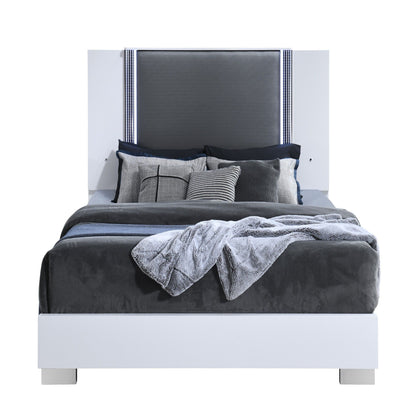 White platform bed with gray upholstered headboard, pillows, and LED-accent trim