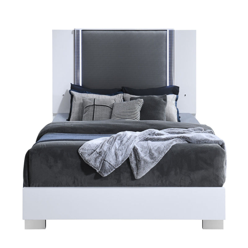 White platform bed with gray upholstered headboard, pillows, and LED-accent trim