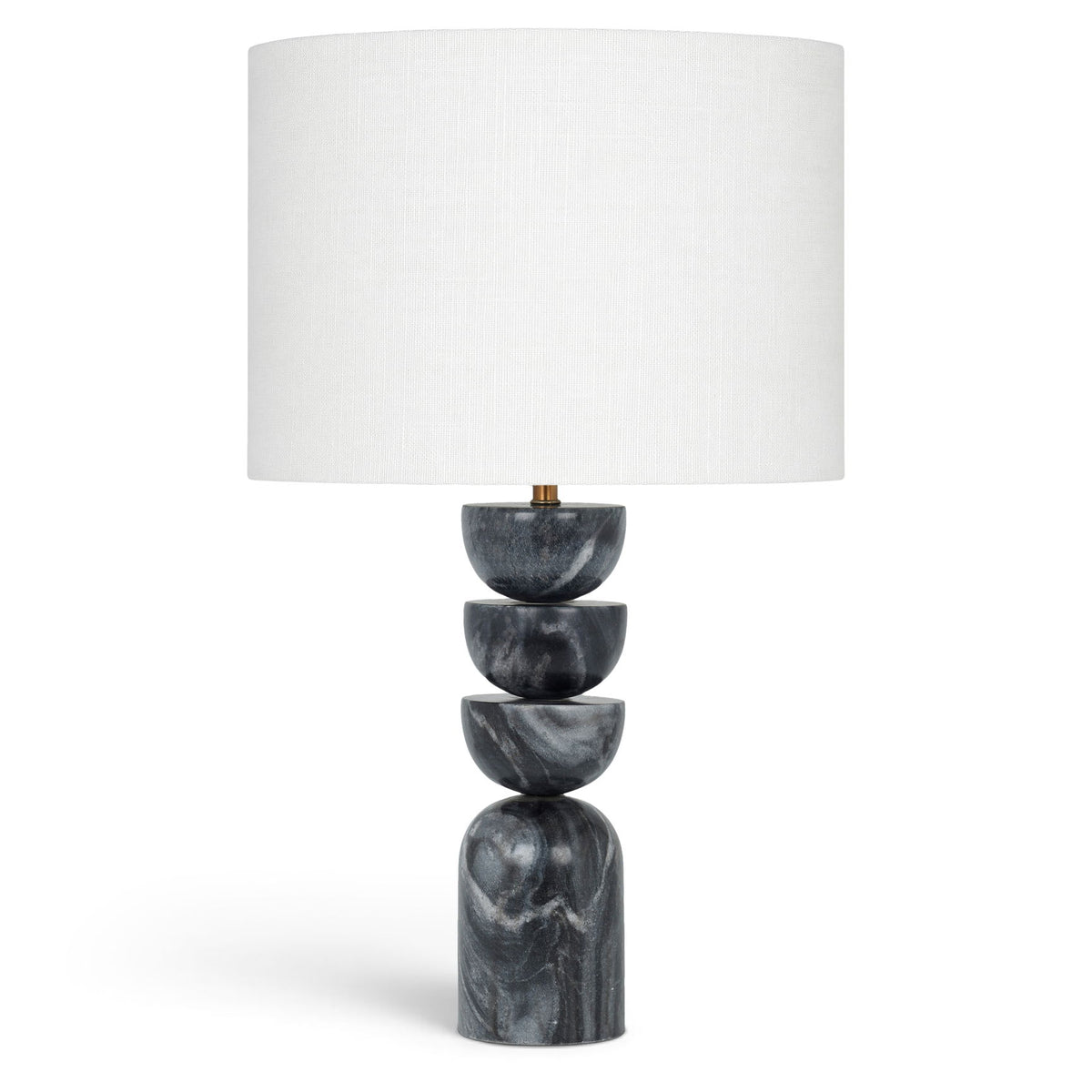 Table lamp with stacked dark marble base and white fabric drum shade, brass accents