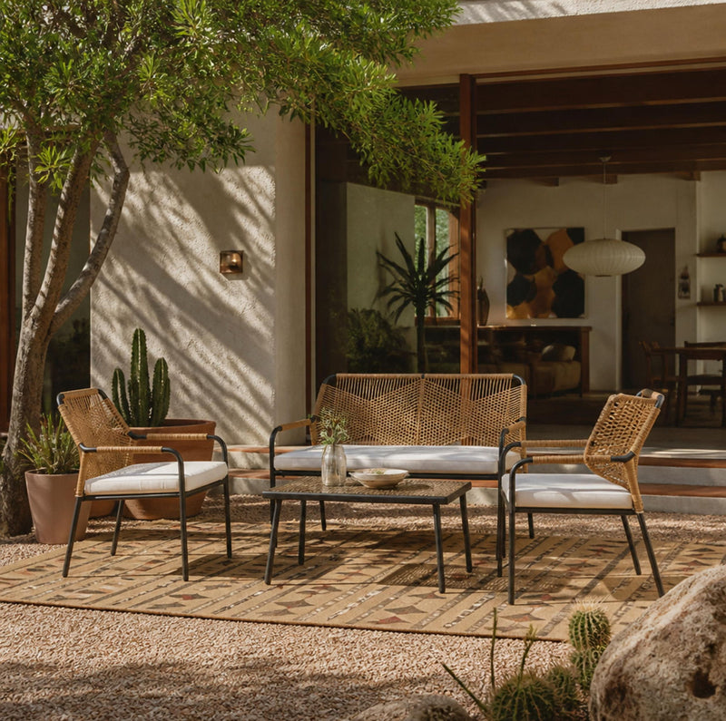 Outdoor conversation seating set with three dark chairs and loveseat with cushions
