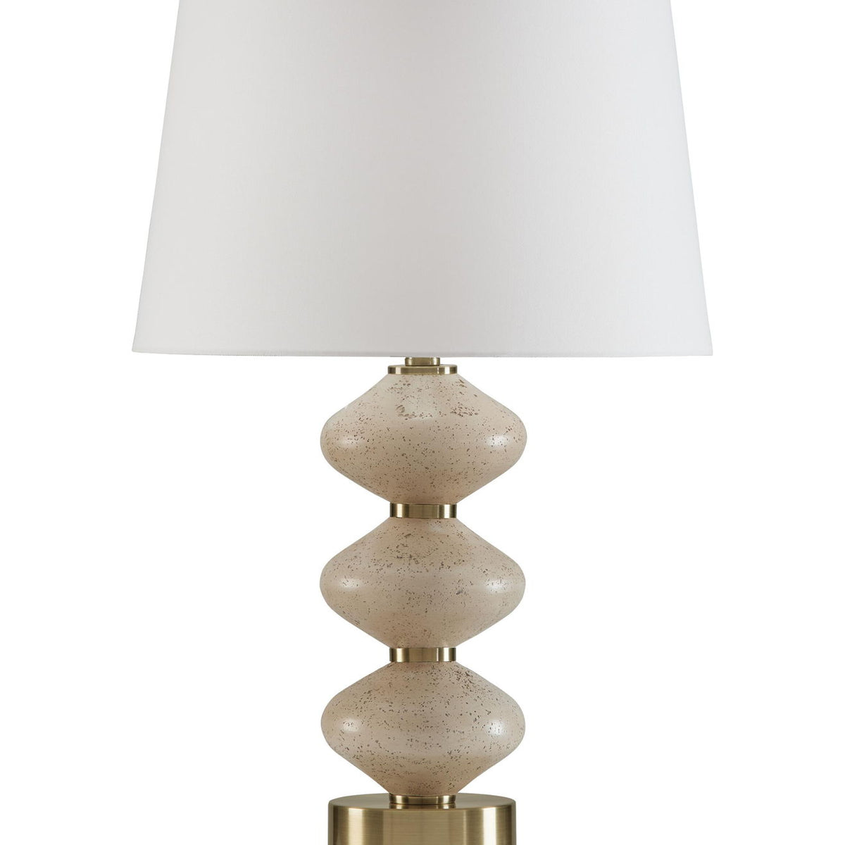 Beige fabric shade over speckled beige and gold table lamp base