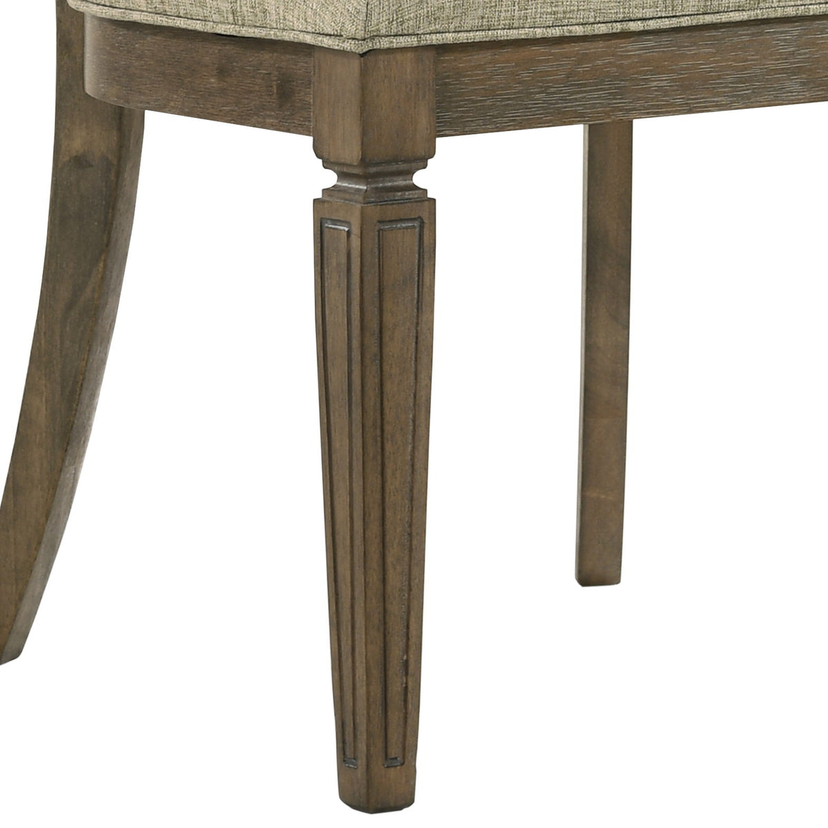 Upholstered dining chair seat with light brown oak legs and apron detail