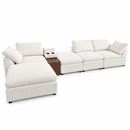 Light beige modular sectional sofa with storage console and chaise ottomans