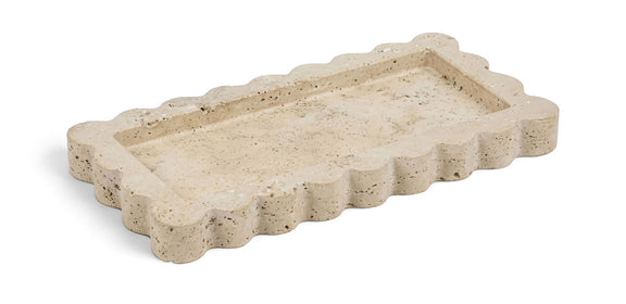 Marble tray with scalloped edge, light beige stone finish with speckled pores.