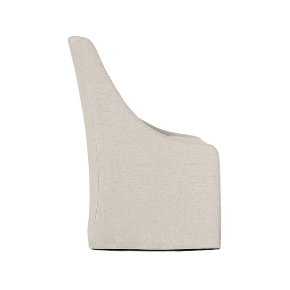 Upholstered rolling dining chair in light beige fabric, angled view showing curved arm