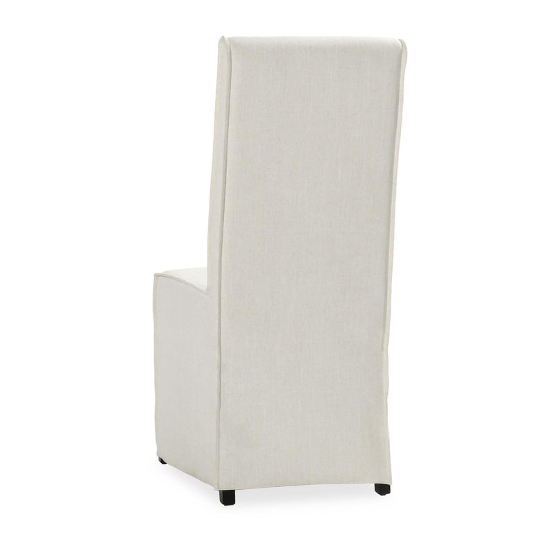 White upholstered dining chair with tall back and side profile, box seat and legs