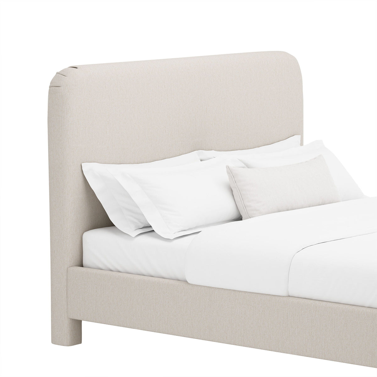 Upholstered bed with rounded headboard and side rails, beige fabric, white bedding