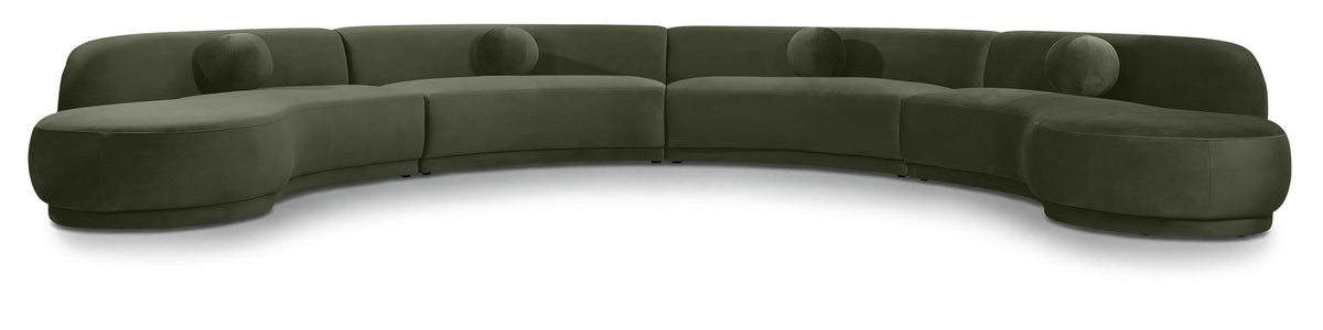 Green velvet sectional sofa with curved design and plush cushions