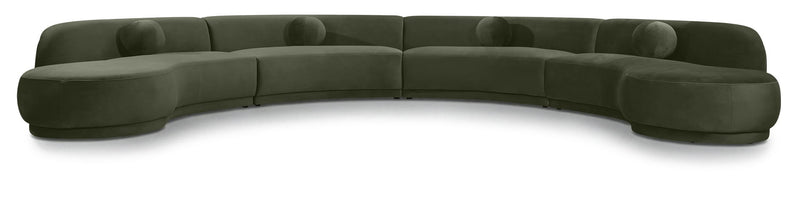 Green velvet sectional sofa with curved design and plush cushions