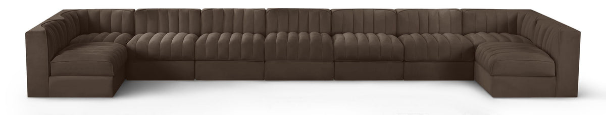 Dark brown velvet modular sectional sofa with tufted cushions and curved armrests