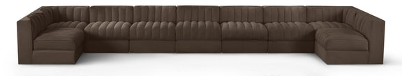 Dark brown velvet modular sectional sofa with tufted cushions and curved armrests