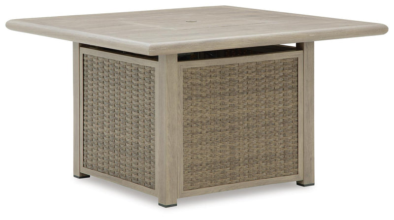 Beige square fire pit table with flat tabletop and woven wicker side panels
