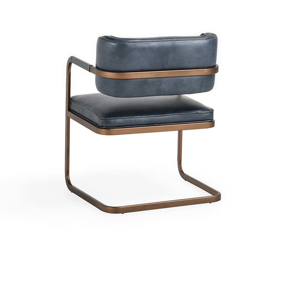 Navy upholstered dining chair with rounded back and padded seat, curved metal base.