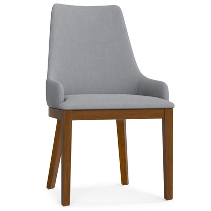 Gray upholstered dining chair with curved back, padded seat, and wooden legs