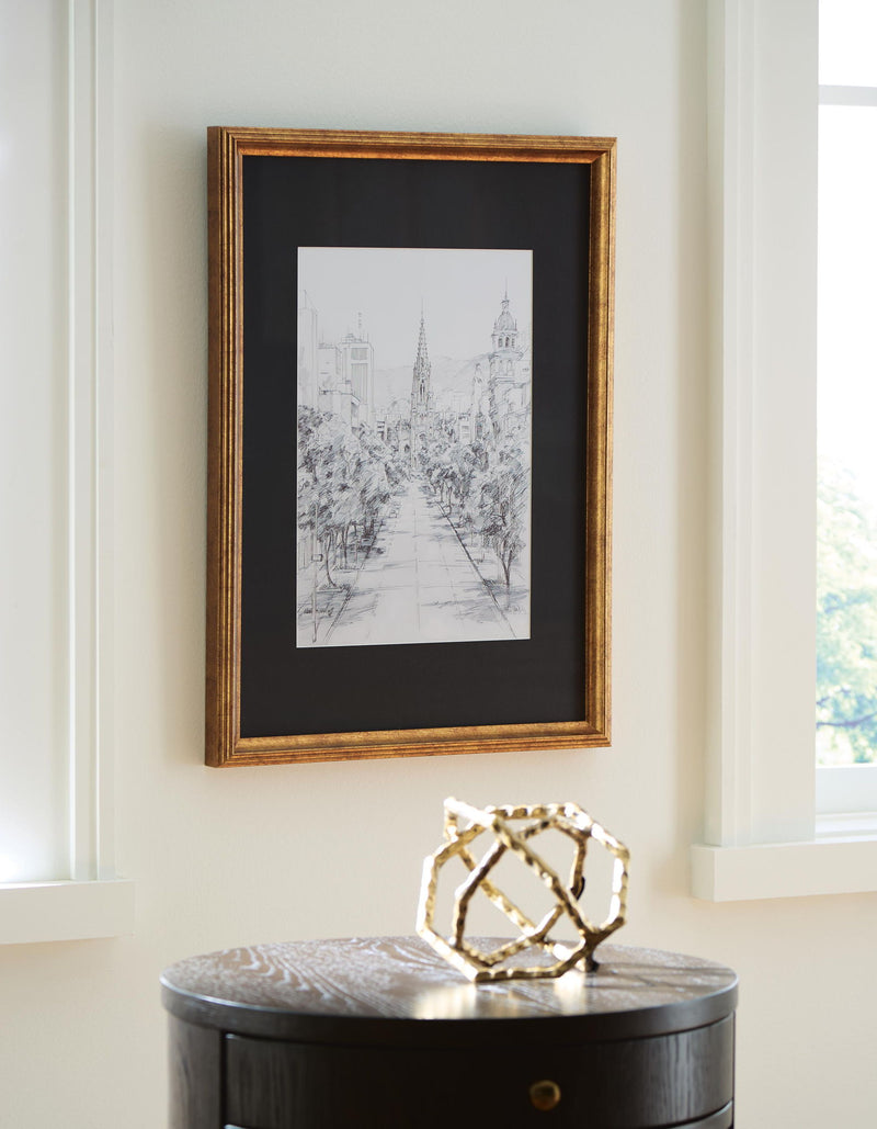 Framed cityscape line drawing wall art with gold-toned wood frame