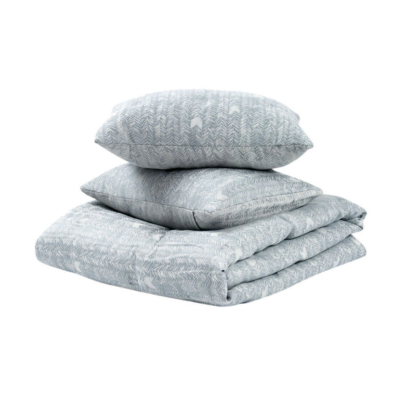 Stacked storm blue comforter and pillow shams with textured herringbone pattern