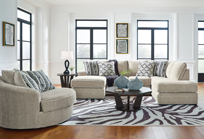 Beige corner chaise sectional sofa with chaise extensions and patterned throw pillows