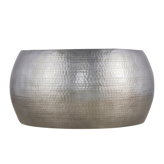 Round ottoman table, hammered light-silver metal drum shape