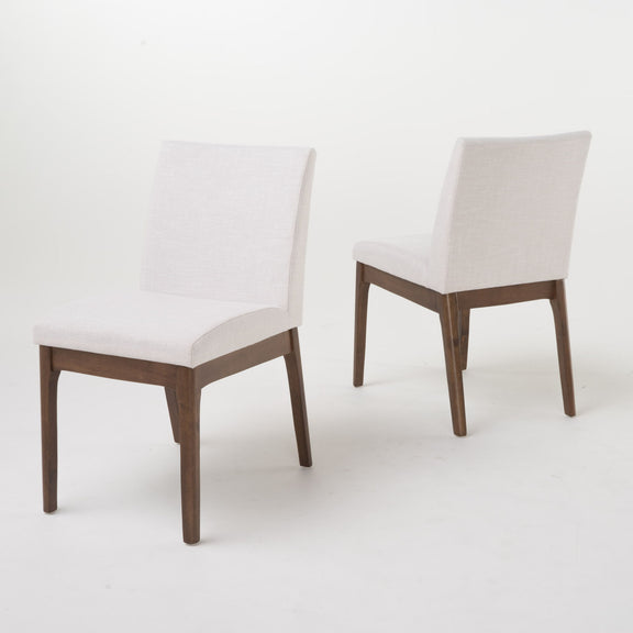 Light beige upholstered dining chairs with dark walnut legs, two-chair view