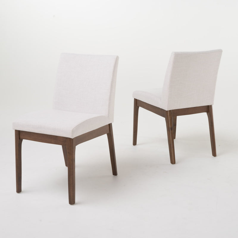 Light beige upholstered dining chairs with dark walnut legs, two-chair view