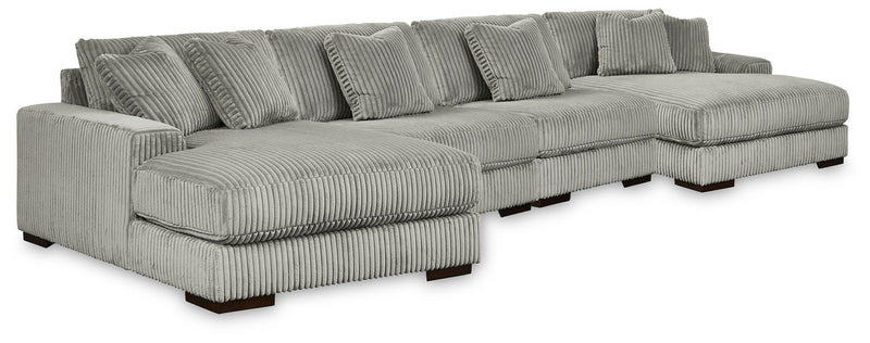Gray ribbed fabric sectional sofa with chaise; tufted back and multiple seat cushions