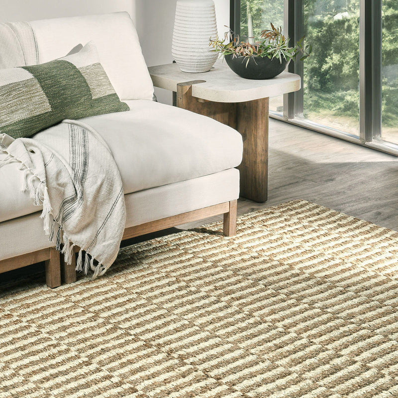 Ivory jute rug with woven stripe texture in a living room setting