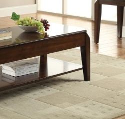 Corner view of dark walnut lift-top coffee table with open storage shelf
