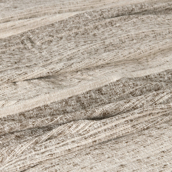 Close-up woven blanket fabric with speckled lines and soft textured finish